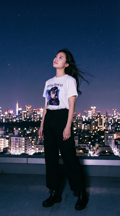 Model wearing Dreams Never End anime shirt on Tokyo rooftop at night — purple and white aesthetic streetwear